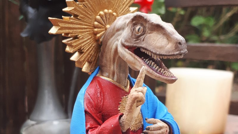 Raptor Jesus figure with golden halo